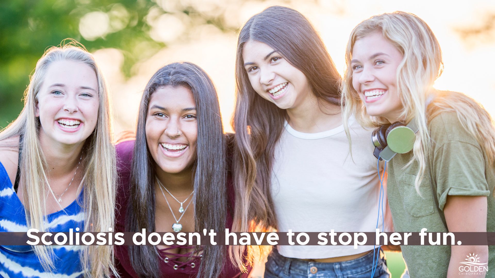 Group of 4 teen girls laughing together