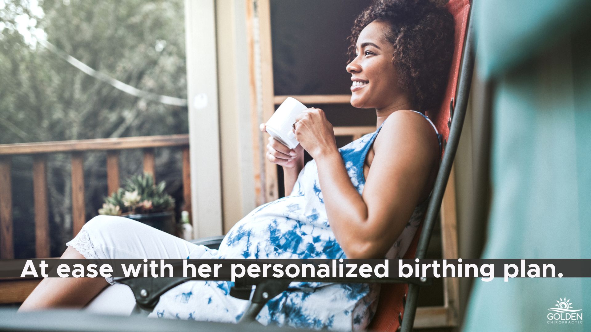 pregnant woman sitting in outdoor chair looking blissful and content