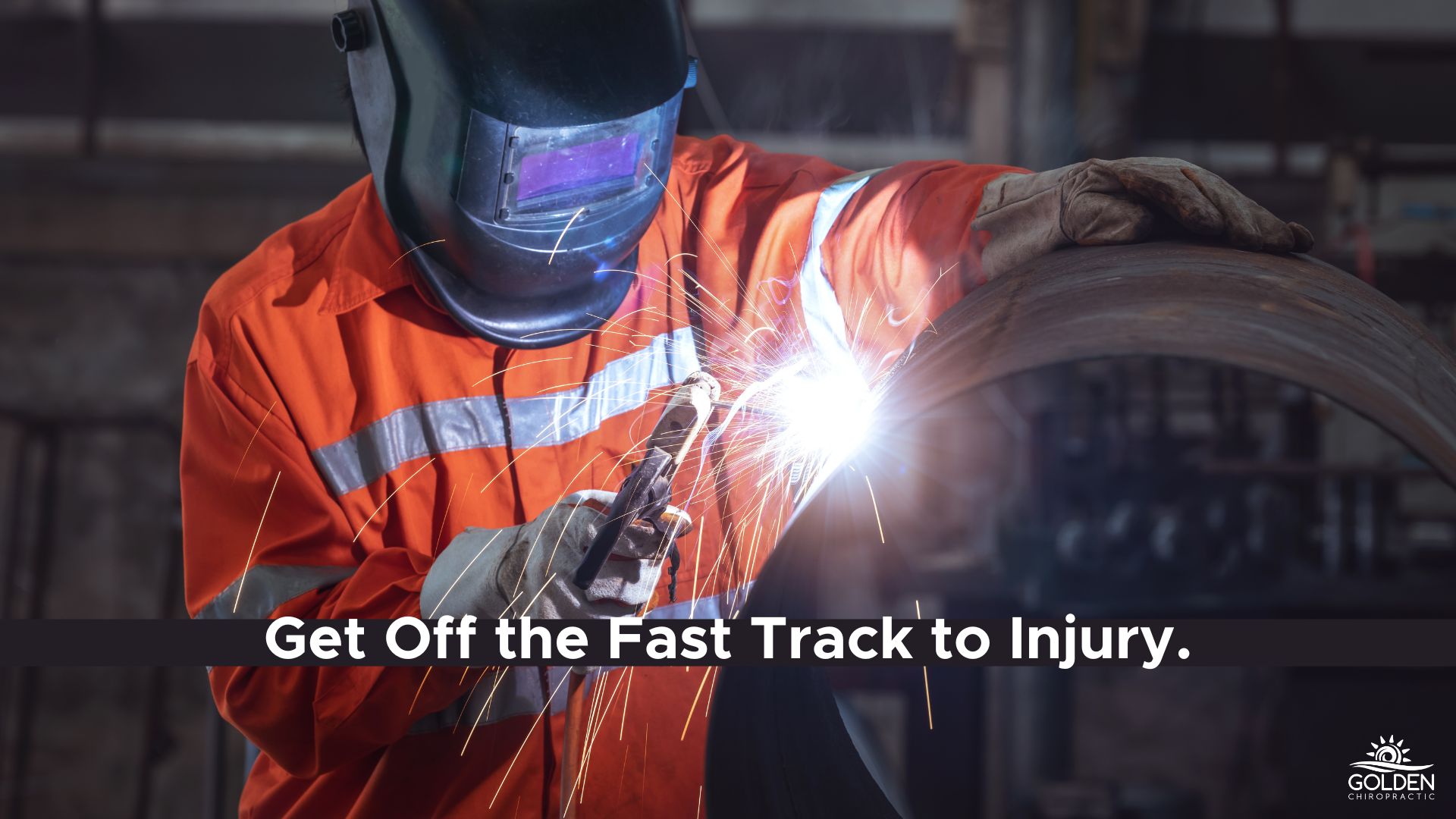 Person in protective helmet, jumpsuit and gloves welding