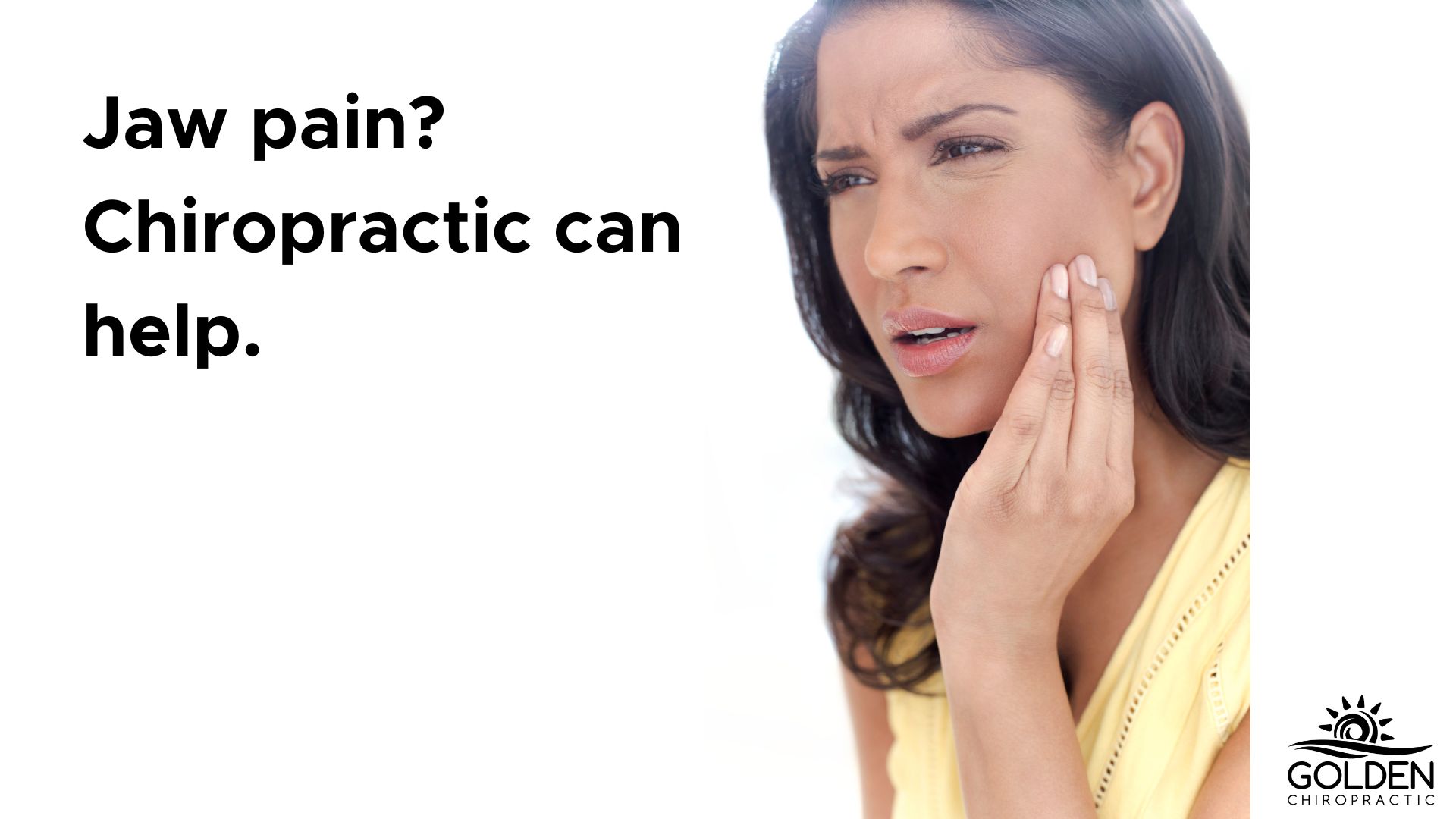 young woman holding her hand to her jaw in pain