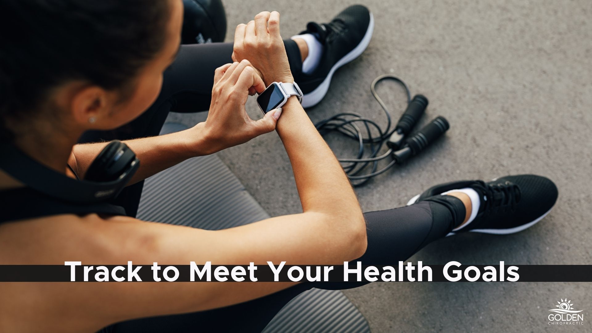 Woman in gym using her fitness watch