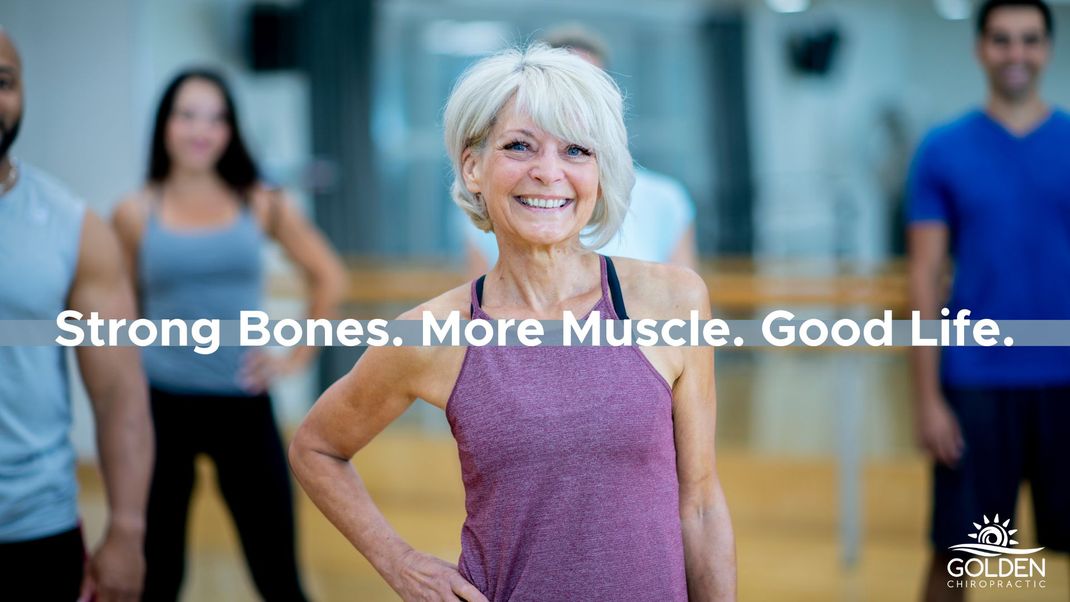 Older woman in an exercise class with a happy smile