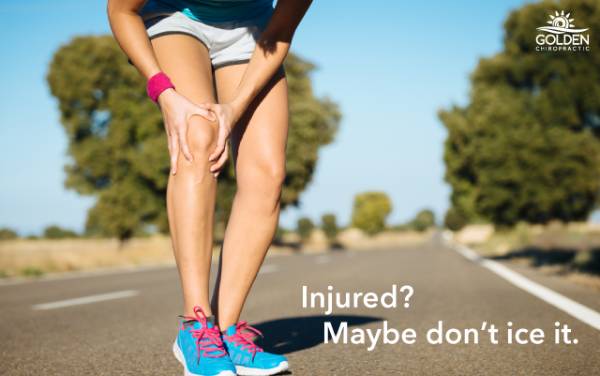 runner clutching knee in pain