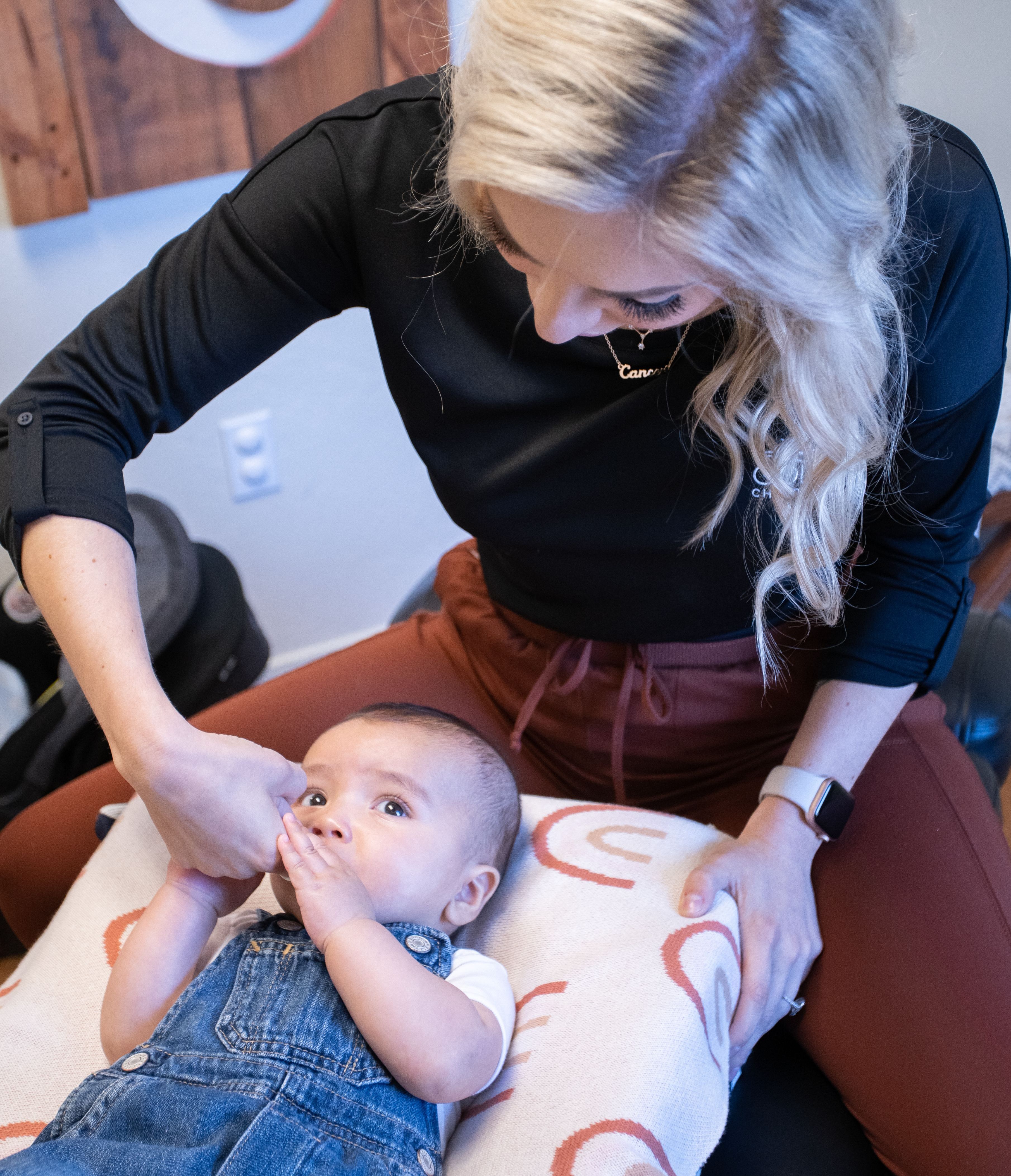 baby getting a finger sweep of the mouth from Dr. Michaela